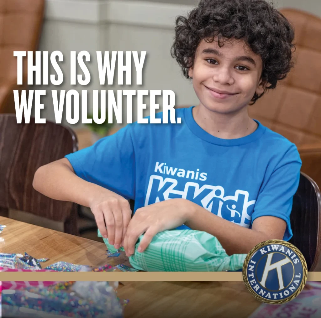 Young volunteer with the message: This is why we volunteer.
